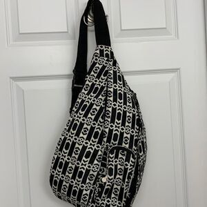 Initials Sling Backpack NWOT black & white with adjustable wide strap